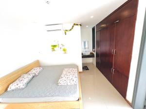 Ein Bett oder Betten in einem Zimmer der Unterkunft KENPI Homestay