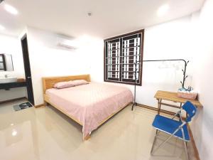 Ein Bett oder Betten in einem Zimmer der Unterkunft KENPI Homestay