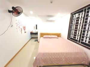Ein Bett oder Betten in einem Zimmer der Unterkunft KENPI Homestay