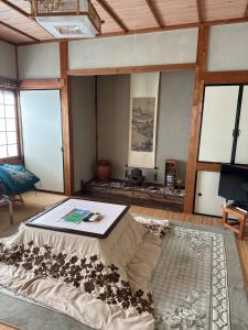 a living room with a bed and a tv at Minpaku Tanaka - Vacation STAY 15255 in Kyotango