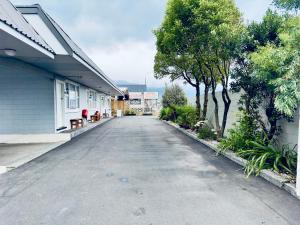 an empty street in front of a building at A1 Kaikoura Motel & Holiday Park in Kaikoura