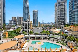 a view of a city with a pool and buildings at Deluxe Twin Studio in Surfers Paradise in Gold Coast