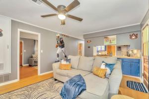 a living room with a couch and a ceiling fan at Capital City Eagle's Nest - Pool Table - Pet Friendly - 6 beds in Montgomery