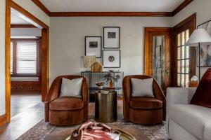 a living room with two chairs and a table at Stunning 3BR - Near Cleveland Clinic Main Campus in Cleveland Heights