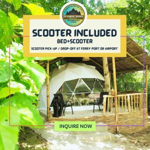 uma tenda com um sinal em frente em Eco Glamping Treehouses Closest Resort To All Tourist Attractions em Balilihan