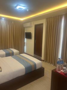 Una cama o camas en una habitación de Nagarkot Resort PVt. Ltd