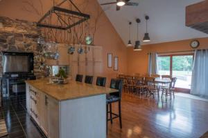 a kitchen and dining room with a table and chairs at The Mountain Lodge in Elliottsburg