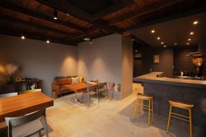 a kitchen and dining room with a table and chairs at NEW OPEN ！1日1組限定、海すぐの一軒家を完全貸切別荘！島の自然を五感で味わえる体験型ホテル in Shikashima