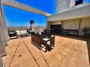 a large living room with a view of the ocean at Los laureles towers in Asunción
