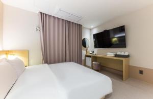 Postel nebo postele na pokoji v ubytování Hotel Aria