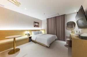 Postel nebo postele na pokoji v ubytování Hotel Aria