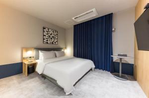 Postel nebo postele na pokoji v ubytování Hotel Aria