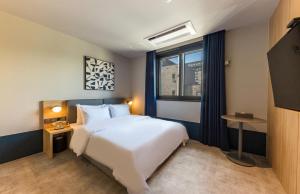 Postel nebo postele na pokoji v ubytování Hotel Aria