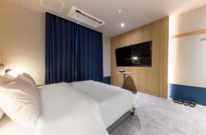 TV a/nebo společenská místnost v ubytování Hotel Aria