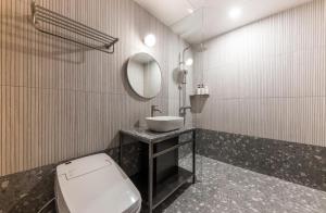Koupelna v ubytování Hotel Aria