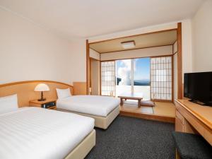 雾岛国际大酒店客房内的一张或多张床位