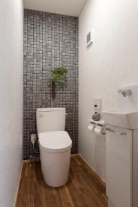 a bathroom with a toilet and a sink at Kungin Bettei - Vacation STAY 14605 in Himeji