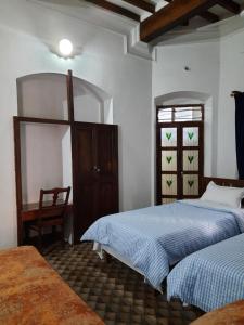 Postel nebo postele na pokoji v ubytování Heritage Home, Hampe's