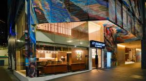 a building with a store with chairs in it at ST Signature Bugis Middle, SHORT OVERNIGHT, 11 hours 8PM-7AM in Singapore