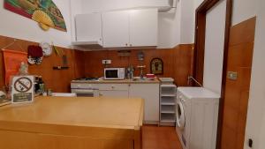 Kuchyňa alebo kuchynka v ubytovaní Relax al Guardastelle - Free parking & Wi-Fi & Air condition