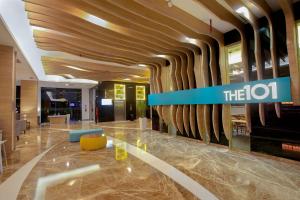 a lobby of a hotel with a sign that reads at THE 1O1 Palembang Rajawali in Palembang