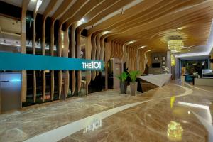 a lobby of a building with a sign that reads the ox at THE 1O1 Palembang Rajawali in Palembang