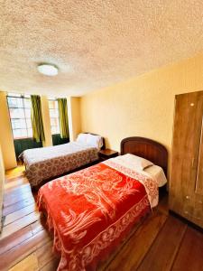 Cama o camas de una habitación en NIIZA HOTEL