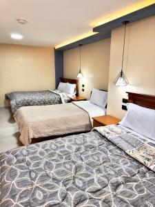מיטה או מיטות בחדר ב-NIIZA HOTEL