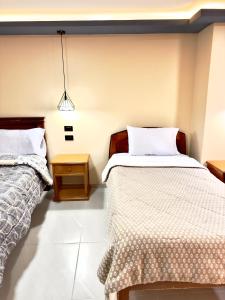 Cama o camas de una habitación en NIIZA HOTEL