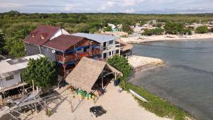 an aerial view of a resort on a beach at Hostel Blue Sea Rincon del Mar in Rincón