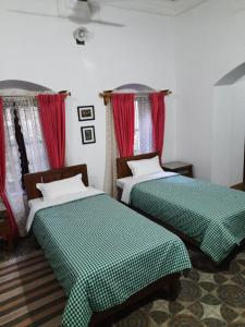 Postel nebo postele na pokoji v ubytování Heritage Home, Hampe's