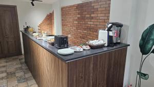 a kitchen with a counter with a coffee maker at Boutique Hotel Filosofia in Tbilisi City