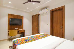 Postel nebo postele na pokoji v ubytování FabHotel La Serene BnB- Ashok Vihar