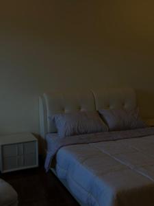 Postel nebo postele na pokoji v ubytování Stutong Stay