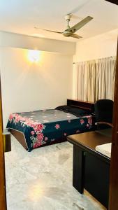 Łóżko lub łóżka w pokoju w obiekcie Oriental Arcadia Elegant Apartment in Gulshan 2