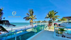 a view of the beach from the balcony of a resort at Ponta Negra Beach beira-mar in Natal