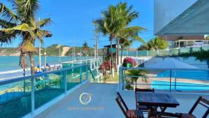 a view of the beach from the balcony of a resort at Ponta Negra Beach beira-mar in Natal