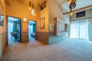 a large room with yellow walls and a hallway at Casa Verde in Saints Constantine and Helena