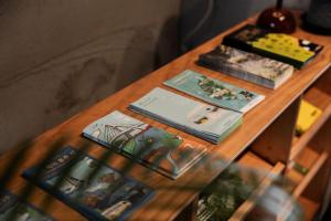a wooden table with books on top of it at 緩慢大鵬灣 in Donggang