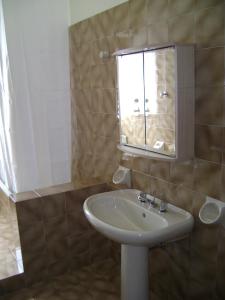 a bathroom with a sink and a mirror at Torrebianca in Erice