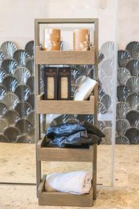 a wooden shelf with some items on it at Naxos Rhyton in Naxos Chora