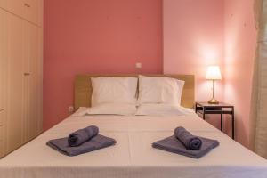En eller flere senger på et rom på Gtrip Ellinikon Experience Apartment - 31506