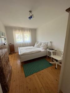 Postel nebo postele na pokoji v ubytování Haus Seeblick