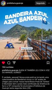 a flyer for a beach with a person sitting on the sand at Praia Tombo Guarujá in Guarujá