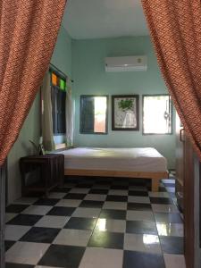 Katil atau katil-katil dalam bilik di Baan Mali Lampang Homestay