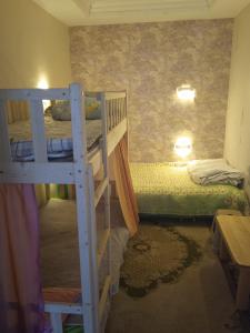 a small room with two bunk beds in it at Bolod Guesthouse and Tours in Ulaanbaatar