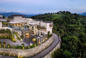 an aerial view of a mansion on a hill at Dusit Thani Himalayan Resort Dhulikhel, Nepal in Dhulikhel +58 photos