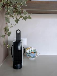 Utensilios para hacer té y café en Chez-Marie Vue fantastique entre lac et montagne