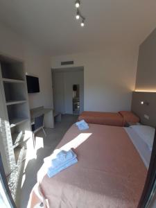 Postel nebo postele na pokoji v ubytování Hotel Altamarea