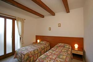 سرير أو أسرّة في غرفة في Agriturismo Parmoleto
